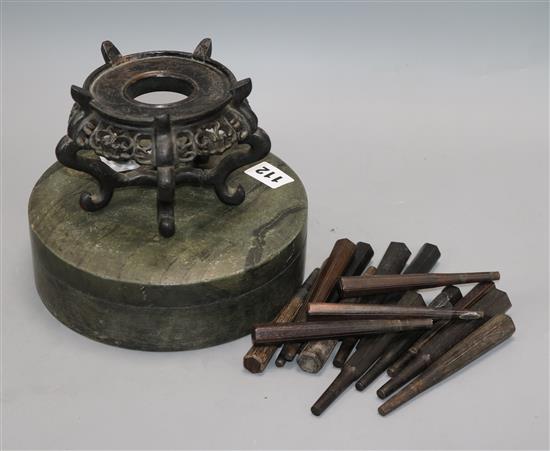 A Chinese slate ink pot, a carved stand and a collection of stringed instrument pegs